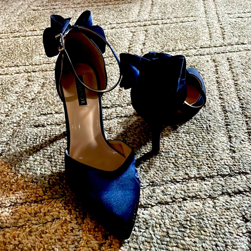 Navy blue satin heels with bow on the heel. Ankle strap.